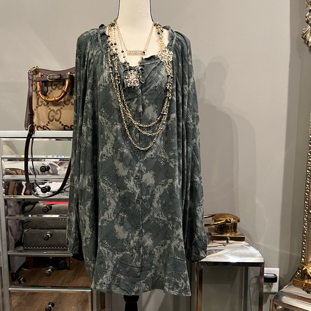 This top is army green, and has designs on it for Doctor Who. Key hole on chest